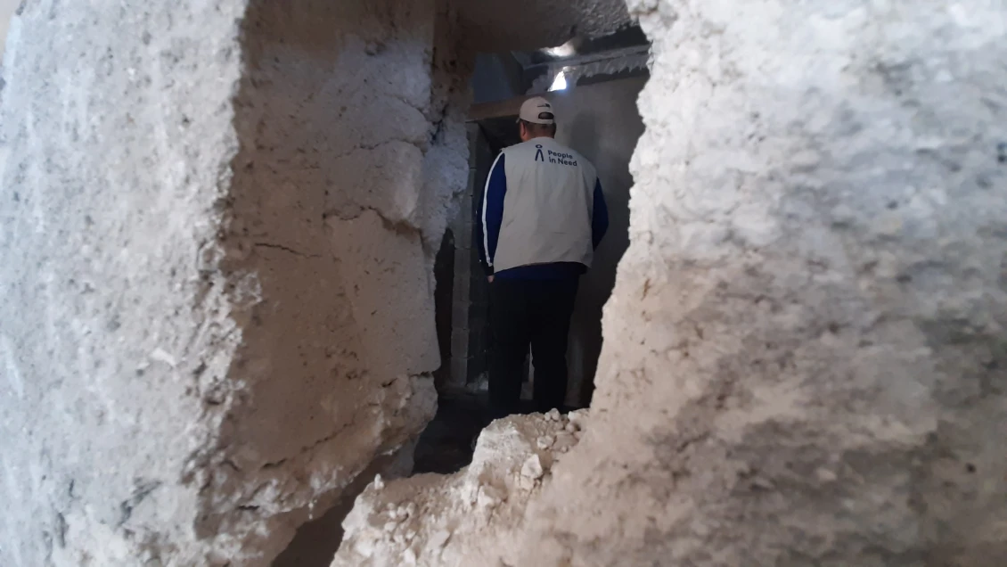 A PIN engineer assessing damage, 