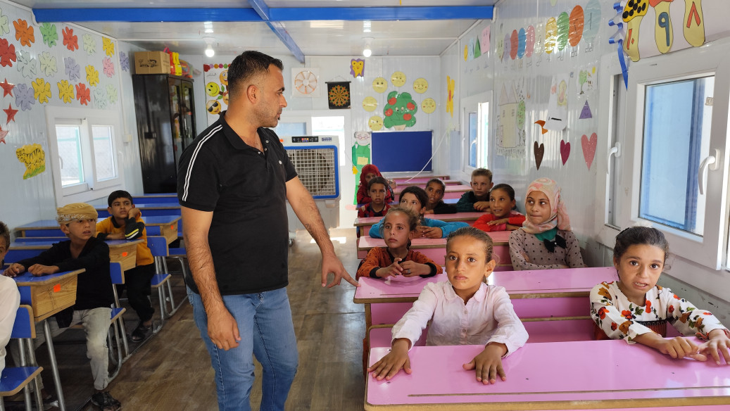 Hamood, in his class in one of the Temporary Learning Centres we support