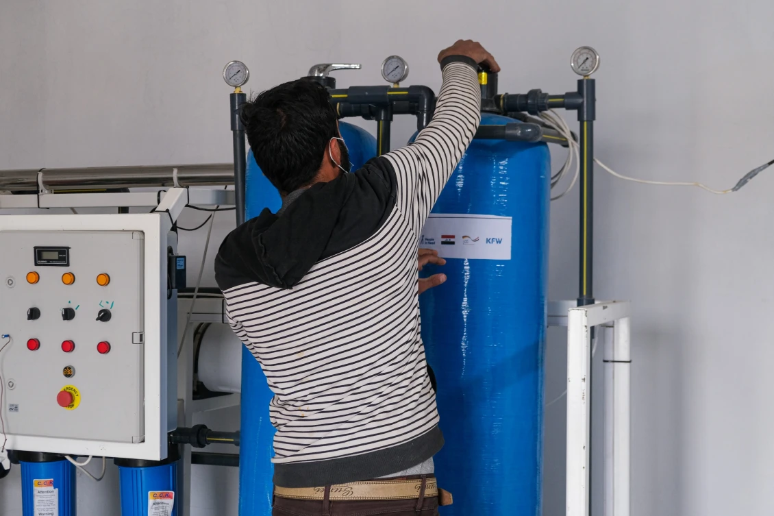 Athir working in his new shop in Beiji, Iraq.