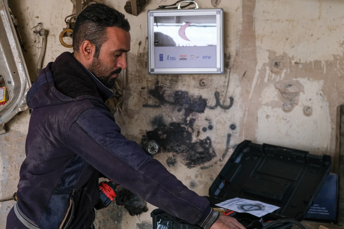 Hamad working in his workshop in his hometown Beiji, Iraq.