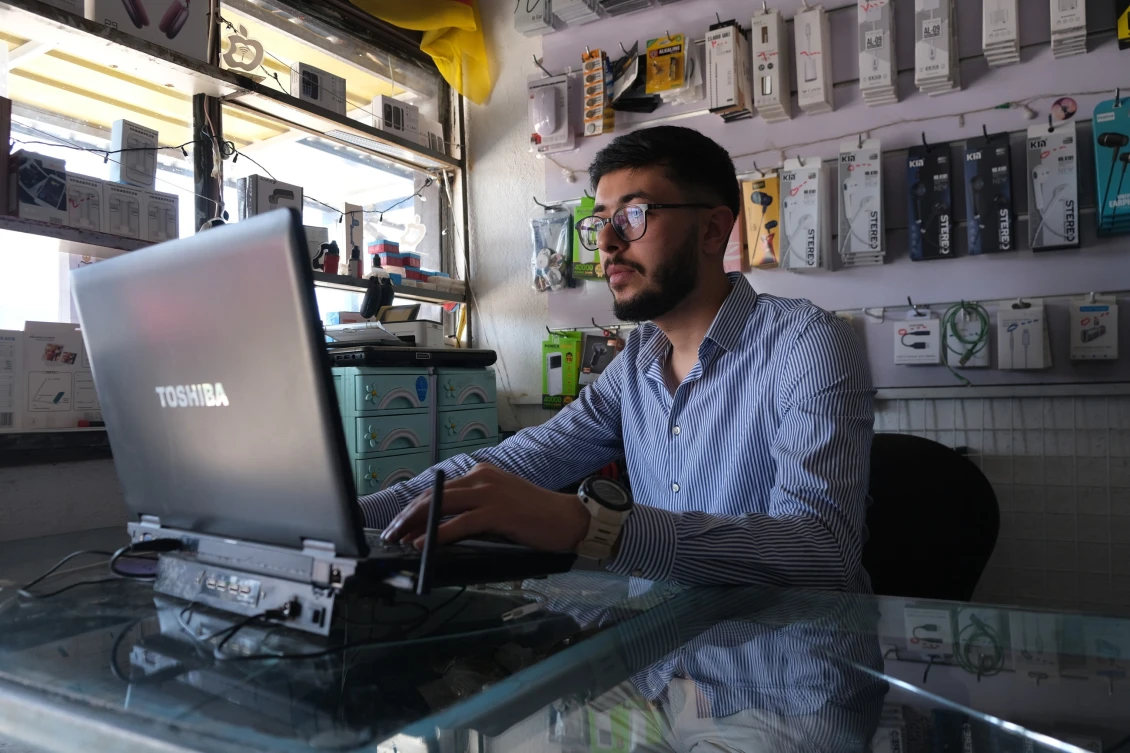 Mohammad working in the mobile shop in Basirma camp, Kurdistan Iraq.